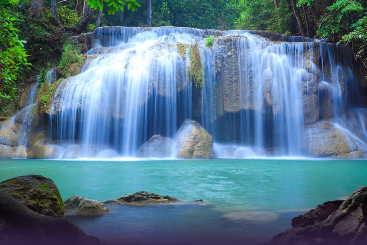 A waterfall with trees in the background