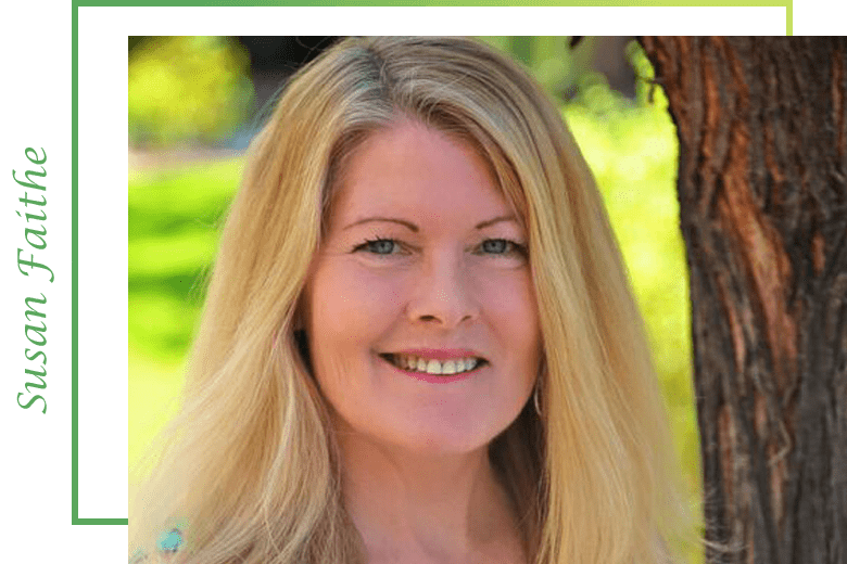 A woman with long blonde hair smiling for the camera.